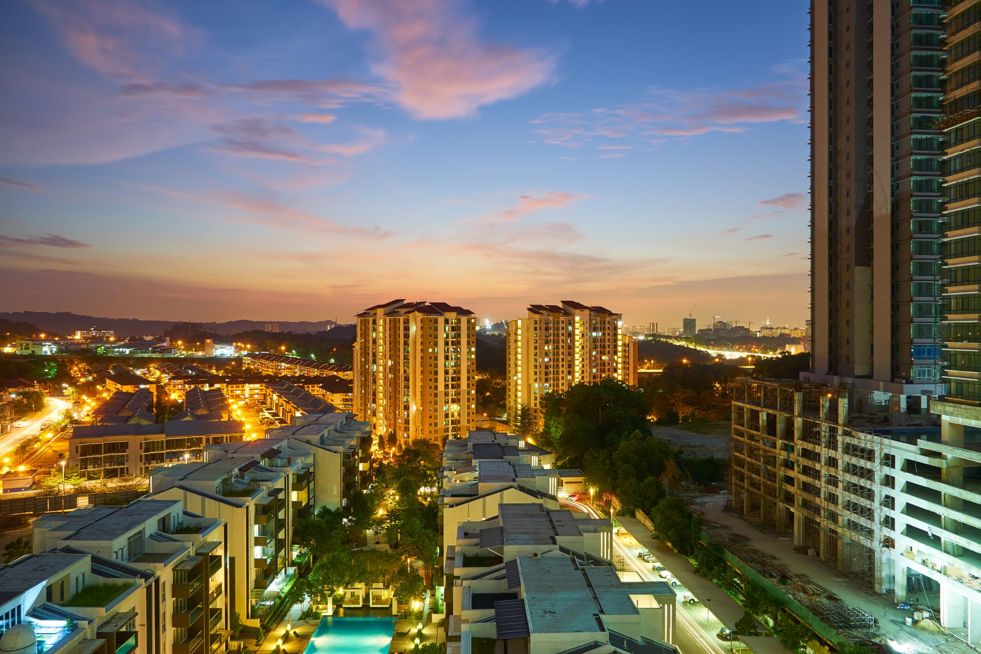 High-rise apartment buildings across the Klang Valley at dusk