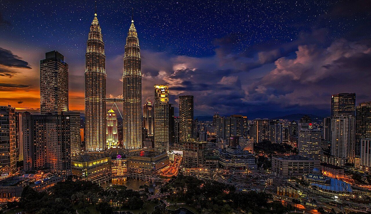 Kuala Lumpur skyline at dusk with the Petronas Twin Towers
